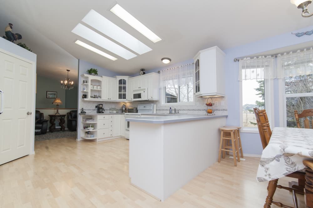 Bright family kitchen example with light finishes and open countertop space.